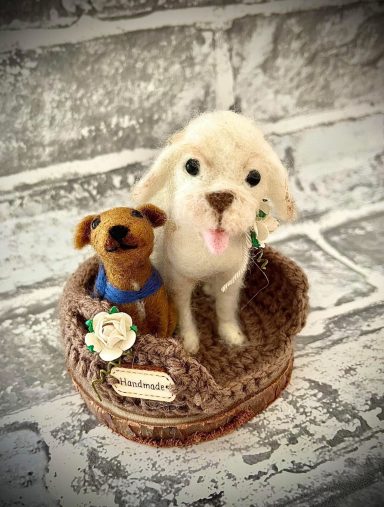 pair of felted pets in a crochet basket